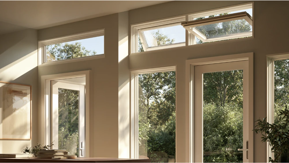 Residential architecture showing a transom window above a door, sidelights beside the door, and clerestory windows high on the wall